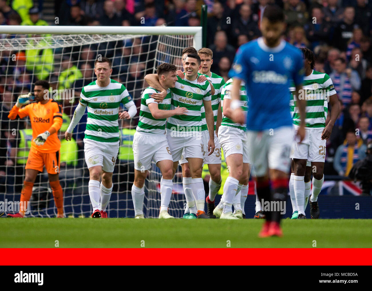 Rangers FC via Press Association Images Celtic's Tom Rogic celebrates his goal with his team mates during the Scottish Cup Semi Final tie at Hampden Park , Glasgow. Stock Photo