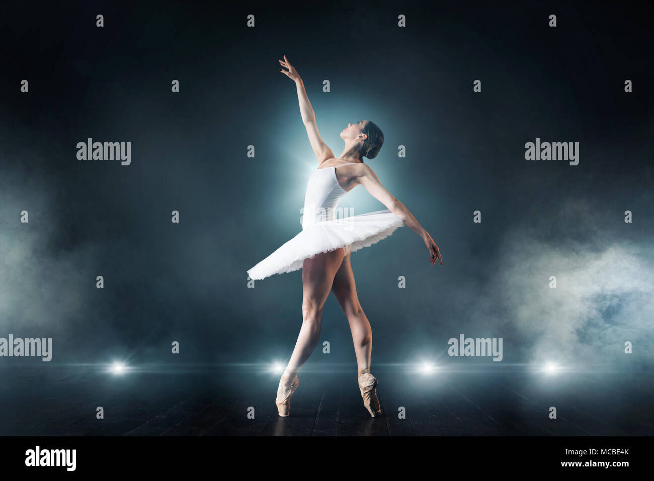 Ballet dancer dancing on the stage in theatre Stock Photo