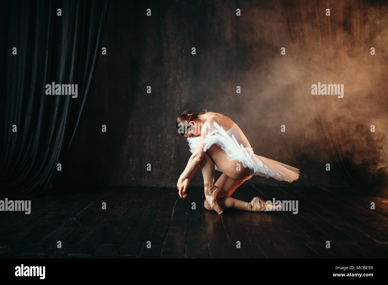Grace of ballerina in motion on theatrical stage Stock Photo