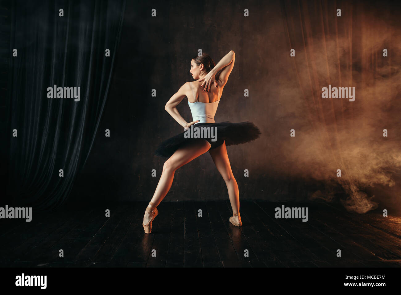 Ballerina in action, dance training on the stage Stock Photo