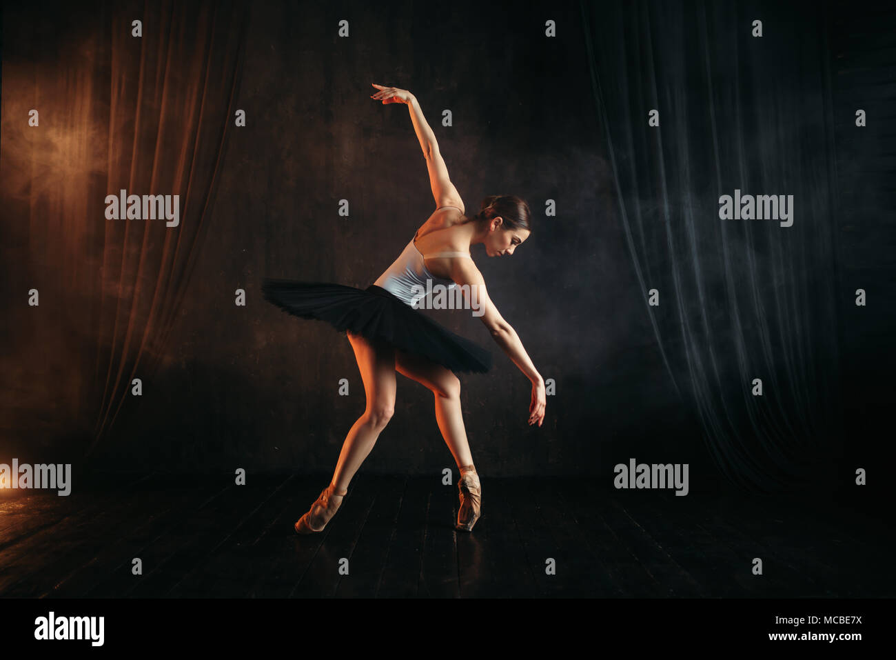 Elegance ballerina in action on theatrical stage Stock Photo