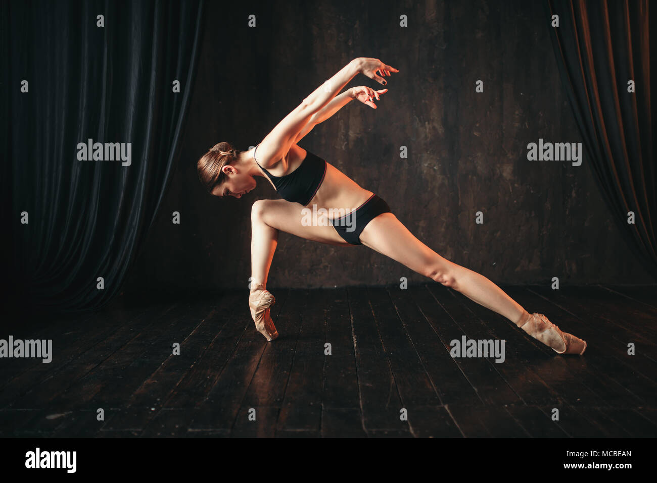 Classical ballet dancer in black practice training Stock Photo