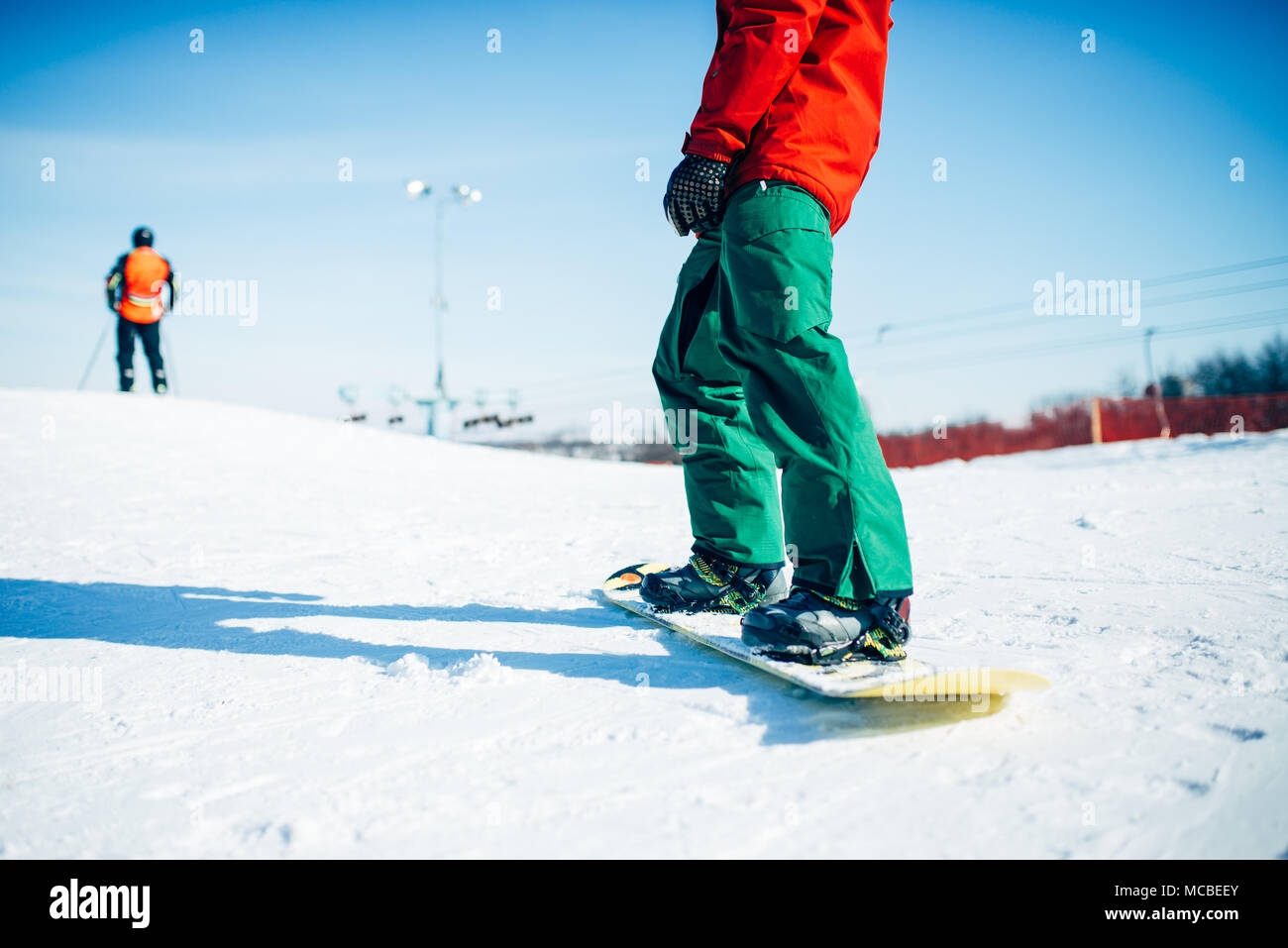 Snowboarder riding a snow hill, extreme sport Stock Photo - Alamy