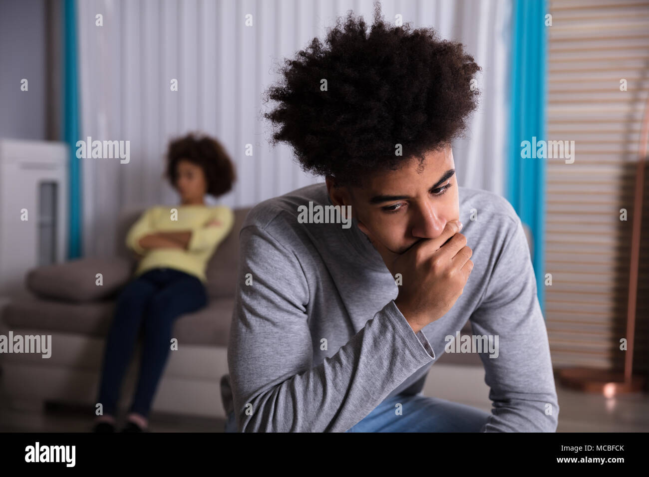 Sad unhappy man sitting on hi-res stock photography and images - Alamy