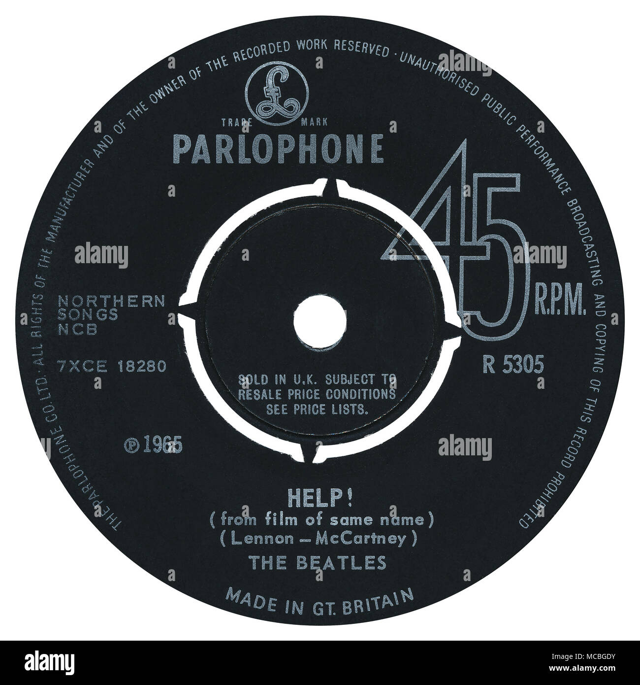 45 RPM 7' UK record label of Help! by The Beatles on Parlophone Records from 1965. Written by John Lennon and Paul McCartney and produced by George Martin. Stock Photo