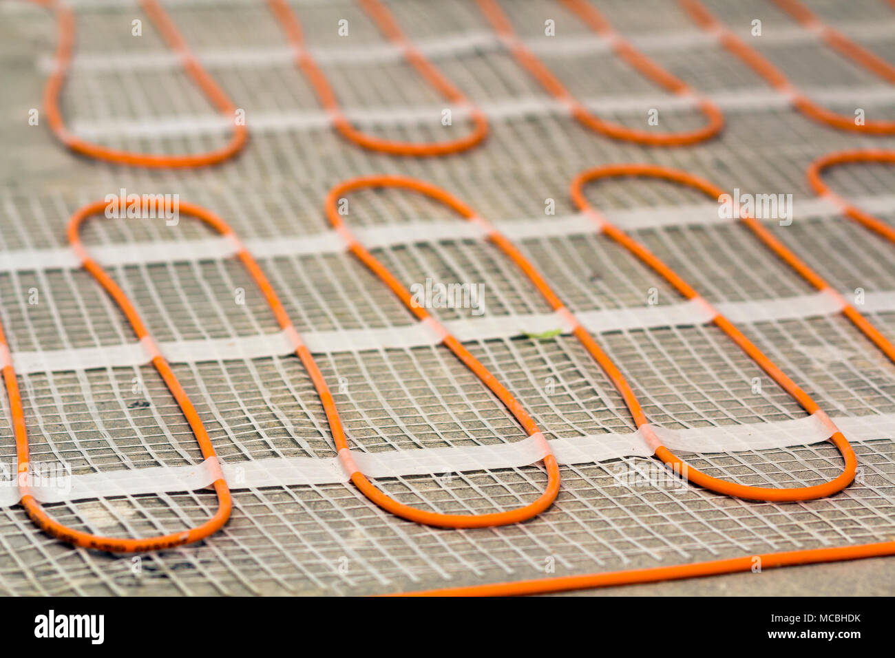 Heating cable for warm floor closeup detail. Renovation works Stock