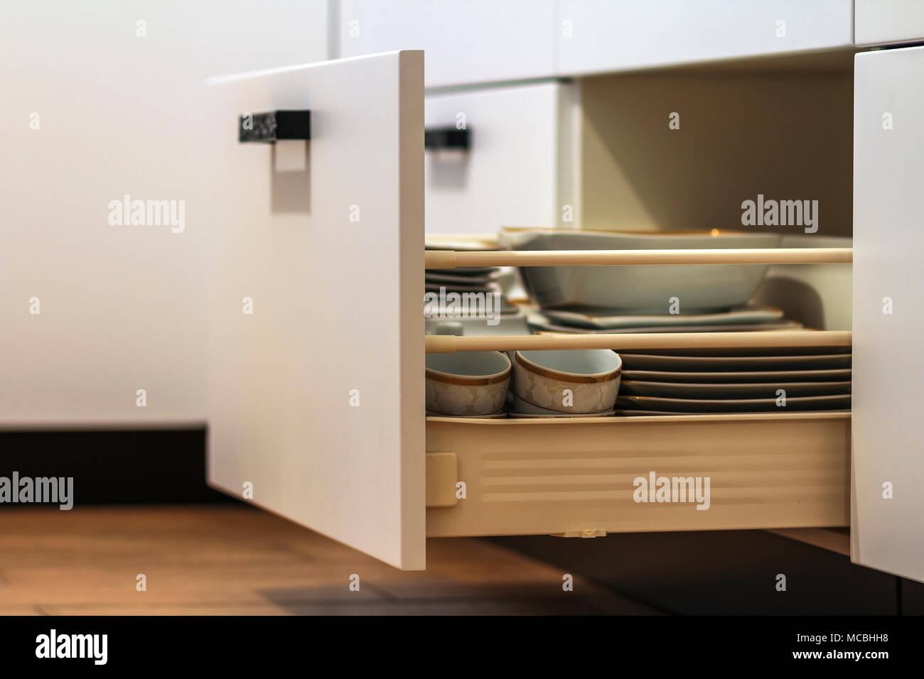 Open Kitchen Drawers With Plates And Cups Dishes Stock Photo