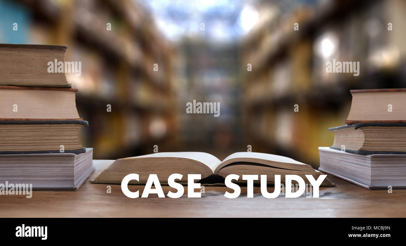 CASE STUDY CONCEPT Book in library with old ollege students studying STUDY and reading Stock Photo