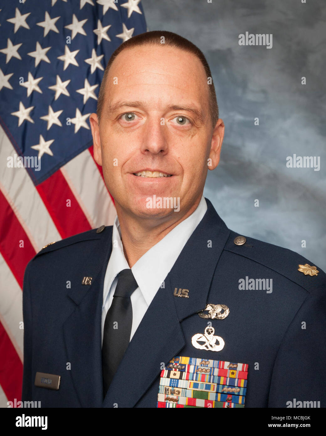 U.S. Air Force Maj. Scott Brochu, 158th Logistics Readiness Squadron operations officer, poses for an official photograph. Stock Photo