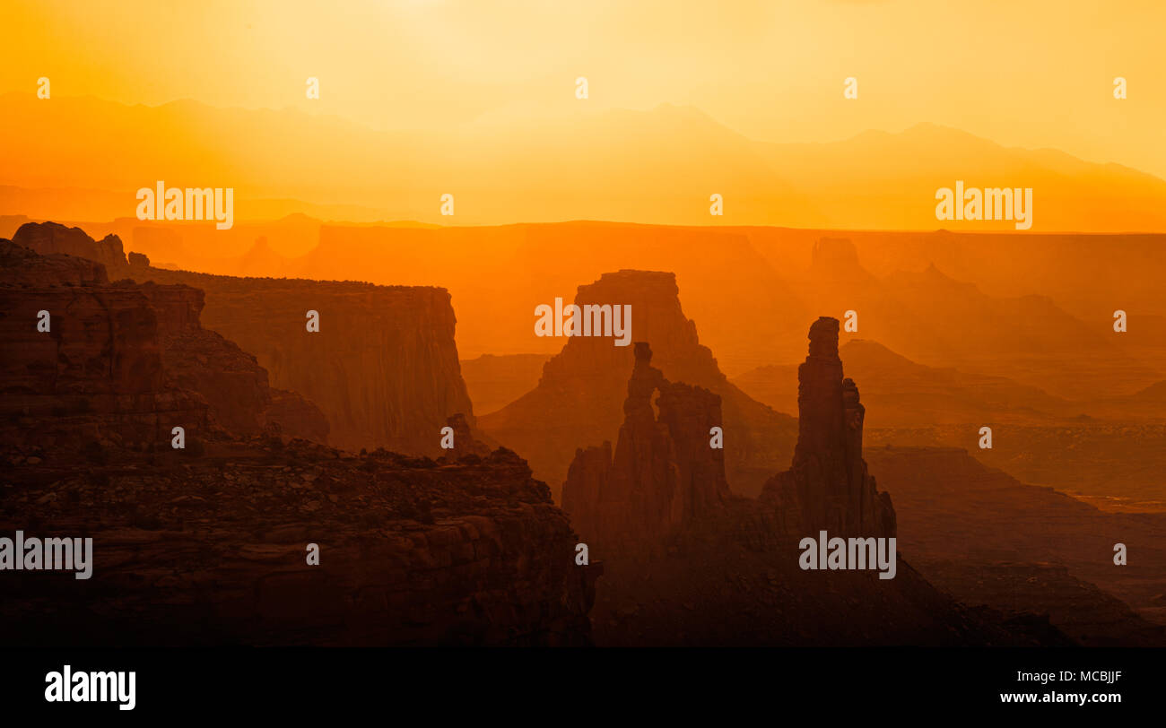 Silhouette, rocks in the morning light, behind the La Sal Mountains, Canyonlands National Park, near Moab, Utah, USA Stock Photo