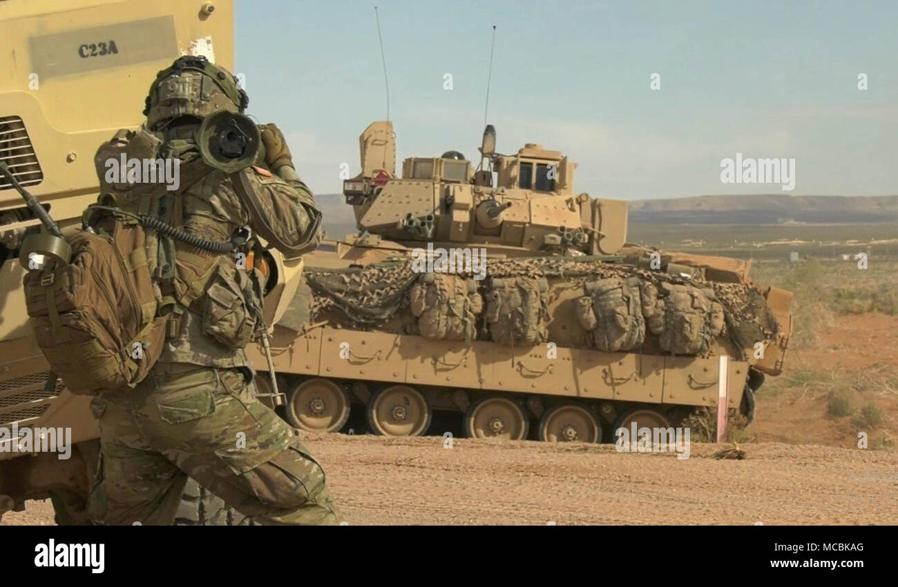 An infantryman with 3rd Battalion, 41st Infantry Regiment, 1st Stryker Brigade Combat Team, 1st Armored Division engages a Bradley Fighting Vehicle with an AT-4 Anti-Tank Weapon during a training exercise at the Combined Arms Collective Training Facility, Orogrande, N.M., March 22, 2018. Soldiers used the Multiple Integrated Laser Engagement System equipment to keep accountability of casualties on the battlefield during simulated firefights. Stock Photo