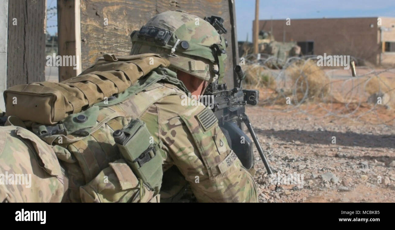 Pfc. Michael Bryers, an automatic rifleman with 3rd Battalion, 41st Infantry Regiment, 1st Stryker Brigade Combat Team, 1st Armored Division returns fire during a training exercise at the Combined Arms Collective Training Facility, Orogrande, N.M., March 22, 2018. Bryers was a member of the opposing force during Iron Focus 18.1, a brigade exercise designed to prepare 3rd Armored Brigade Combat Team, 1st Armored Division for a National Training Center rotation. Stock Photo