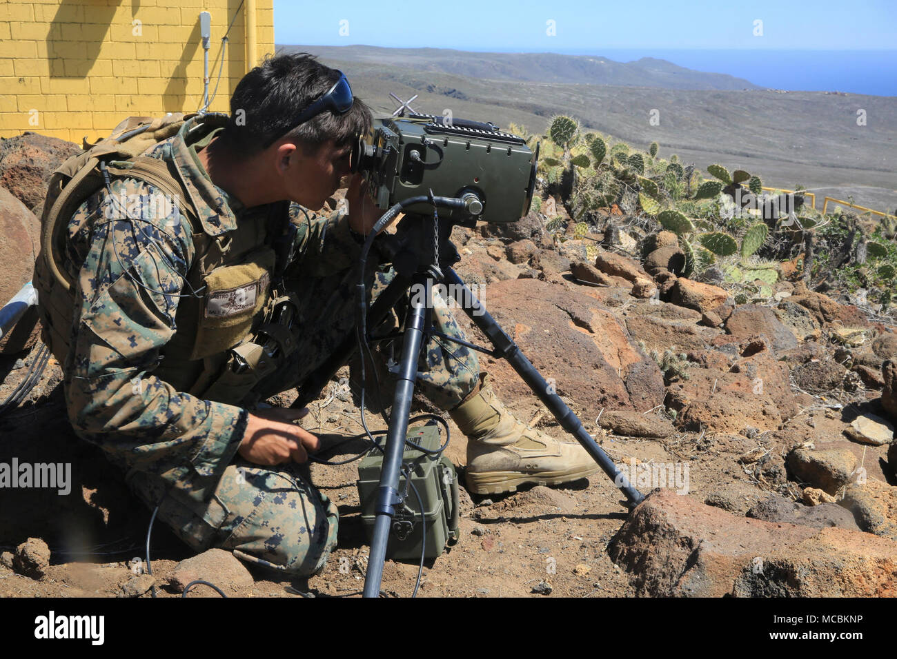 cpl-ryan-castro-a-joint-fires-observer-with-1st-air-naval-gunfire-liaison-company-13th-marine-expeditionary-unit-uses-a-portable-laser-designator-range-finder-to-guide-a-bomb-to-the-target-on-san-clemente-island-california-march-28-2018-the-essex-amphibious-ready-group-and-13th-meu-fully-integrated-for-the-first-time-before-their-summer-deployment-amphibious-squadron-meu-integration-training-is-a-crucial-pre-deployment-exercise-that-allows-the-navy-marine-corps-team-to-rapidly-plan-and-execute-complex-operations-from-naval-shipping-MCBKNP.jpg