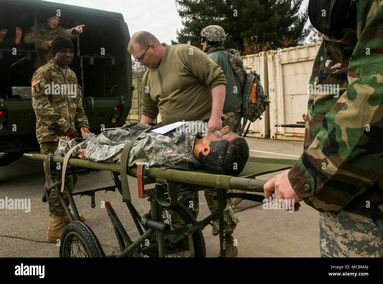U.S. Army Reserve Soldiers with the Effects and Enabler Team load up simulated wounded Soldiers to be transported to one of the Combat Support Hospitals participating in the Combat Support Training Exercise 78-18-03, at Fort McCoy, Wisconsin, March 22, 2018. CSTX ensures America’s Army Reserve units and Soldiers are trained and ready to deploy on short-notice and bring capable, combat-ready and lethal firepower in support of the Army and our joint partners anywhere in the world. Stock Photo
