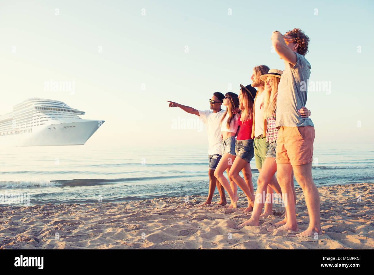 Group of happy friends having fun at ocean beach. Travel with cruiseship concept Stock Photo