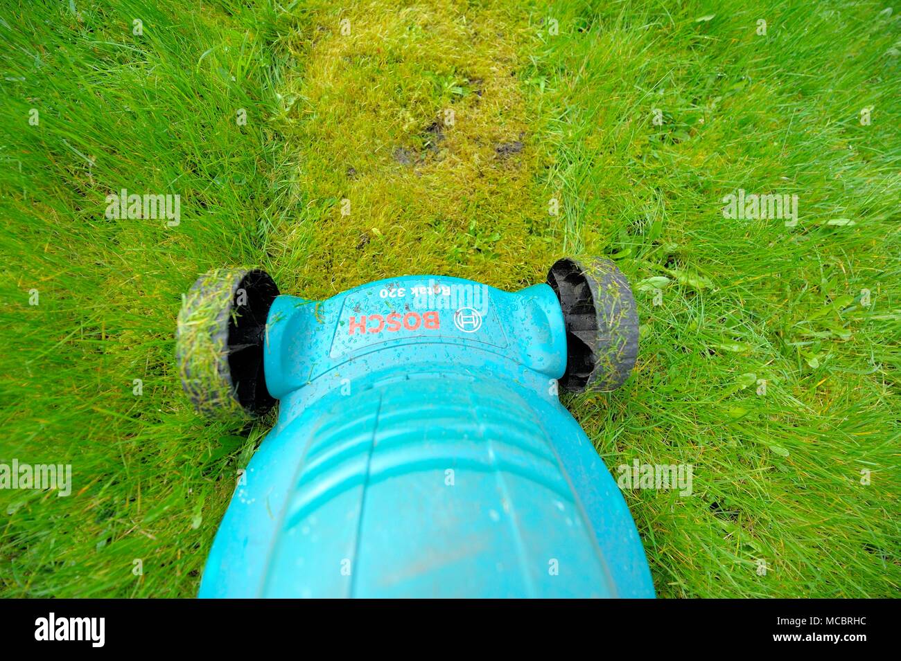 First lawn cut of the year Stock Photo Alamy