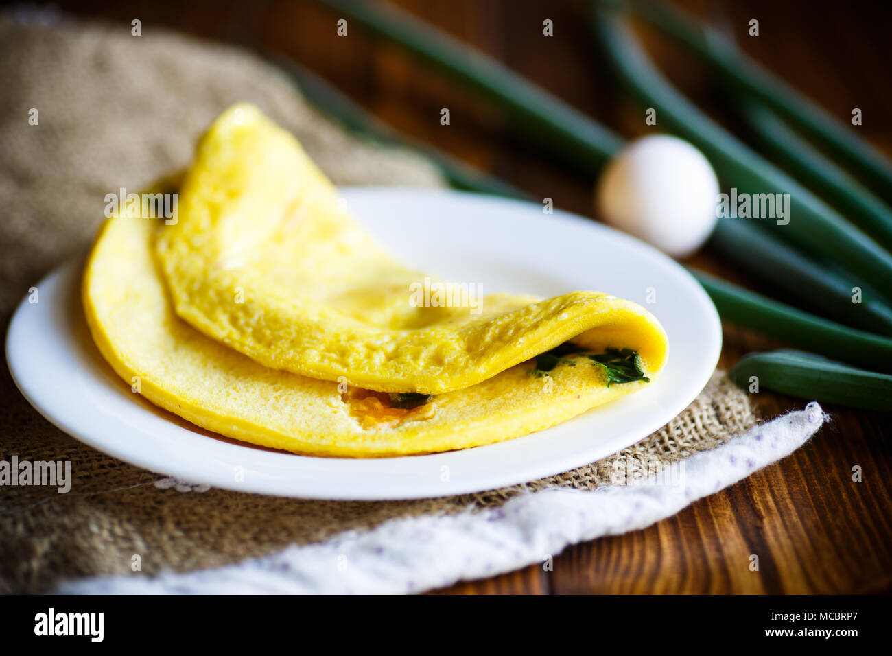 omelette from chicken eggs with green onion Stock Photo
