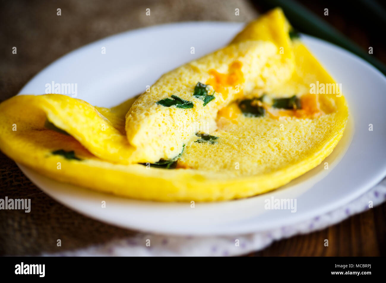 omelette from chicken eggs with green onion Stock Photo