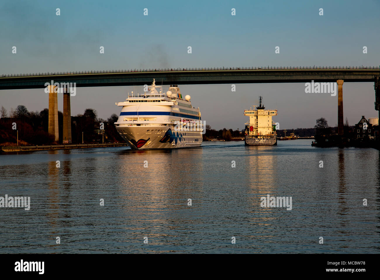 Various vessels on transit through the Kiel canal from the locks at Brunsbuttel through to Kiel Stock Photo