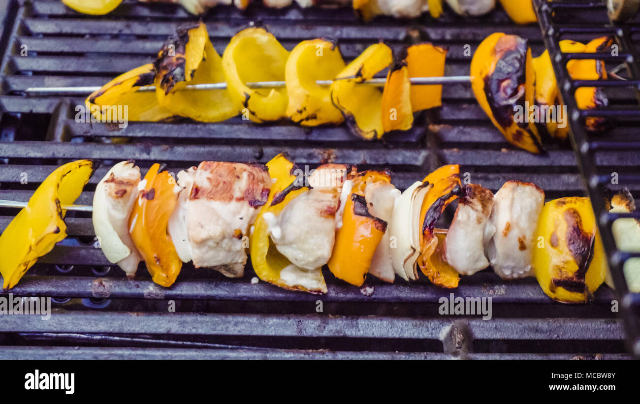 Step by step. Cooking chicken shish kabobs with bell peppers and yellow