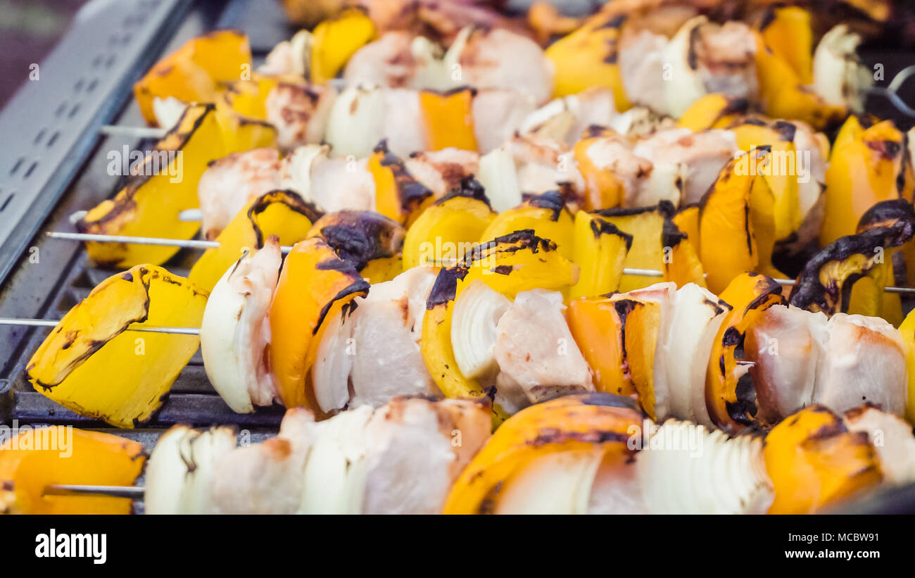 Step by step. Cooking chicken shish kabobs with bell peppers and yellow
