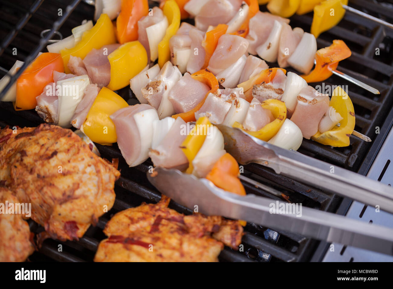 Step by step. Cooking chicken shish kabobs with bell peppers and yellow