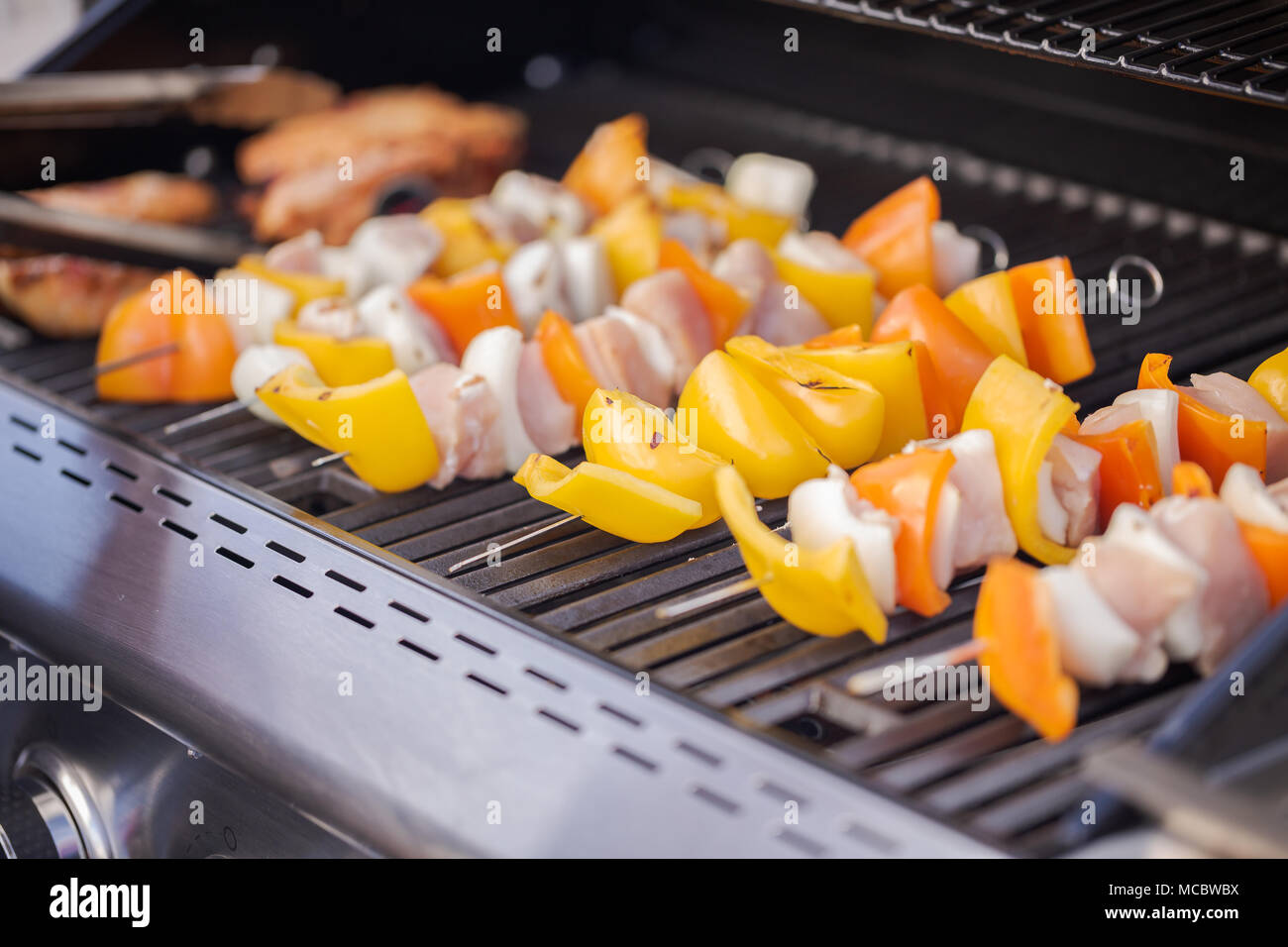 Step by step. Cooking chicken shish kabobs with bell peppers and yellow