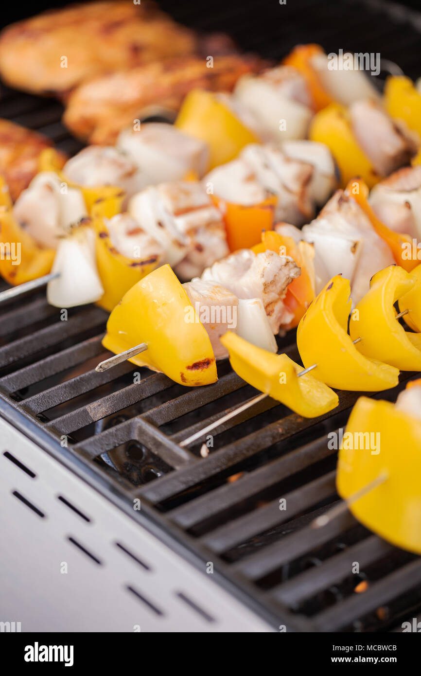 Step by step. Cooking chicken shish kabobs with bell peppers and yellow
