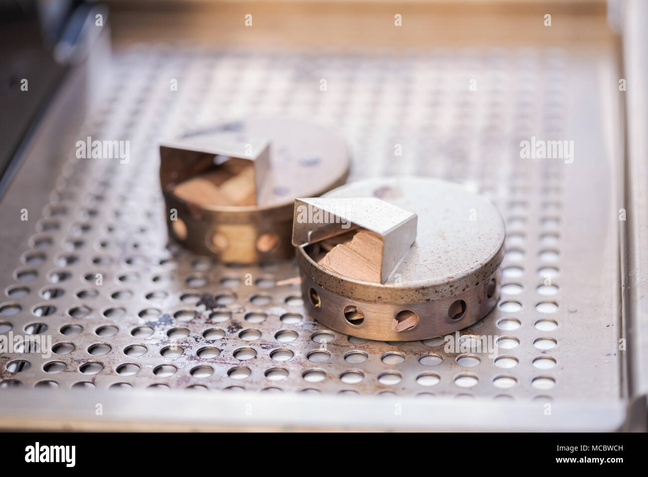 Stainless steel wood chip smoker box for gas grill Stock Photo Alamy