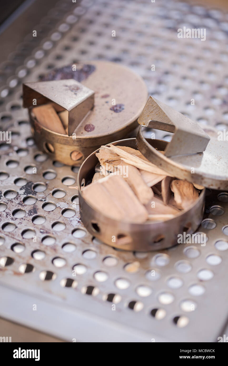 Stainless steel wood chip smoker box for gas grill Stock Photo Alamy