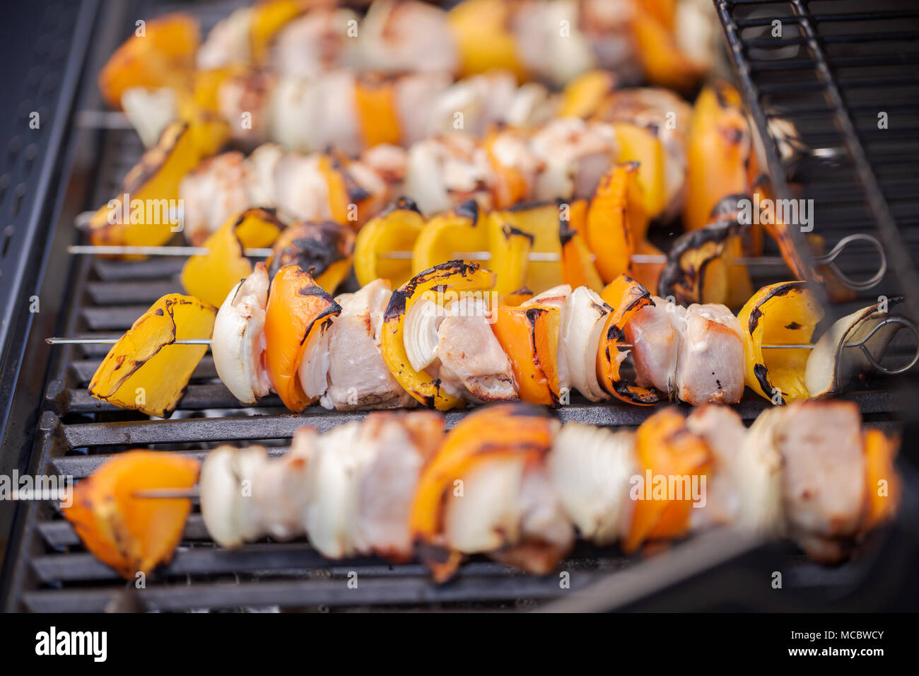 Step by step. Cooking chicken shish kabobs with bell peppers and yellow