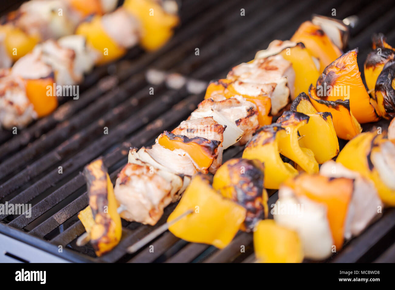 Step by step. Cooking chicken shish kabobs with bell peppers and yellow