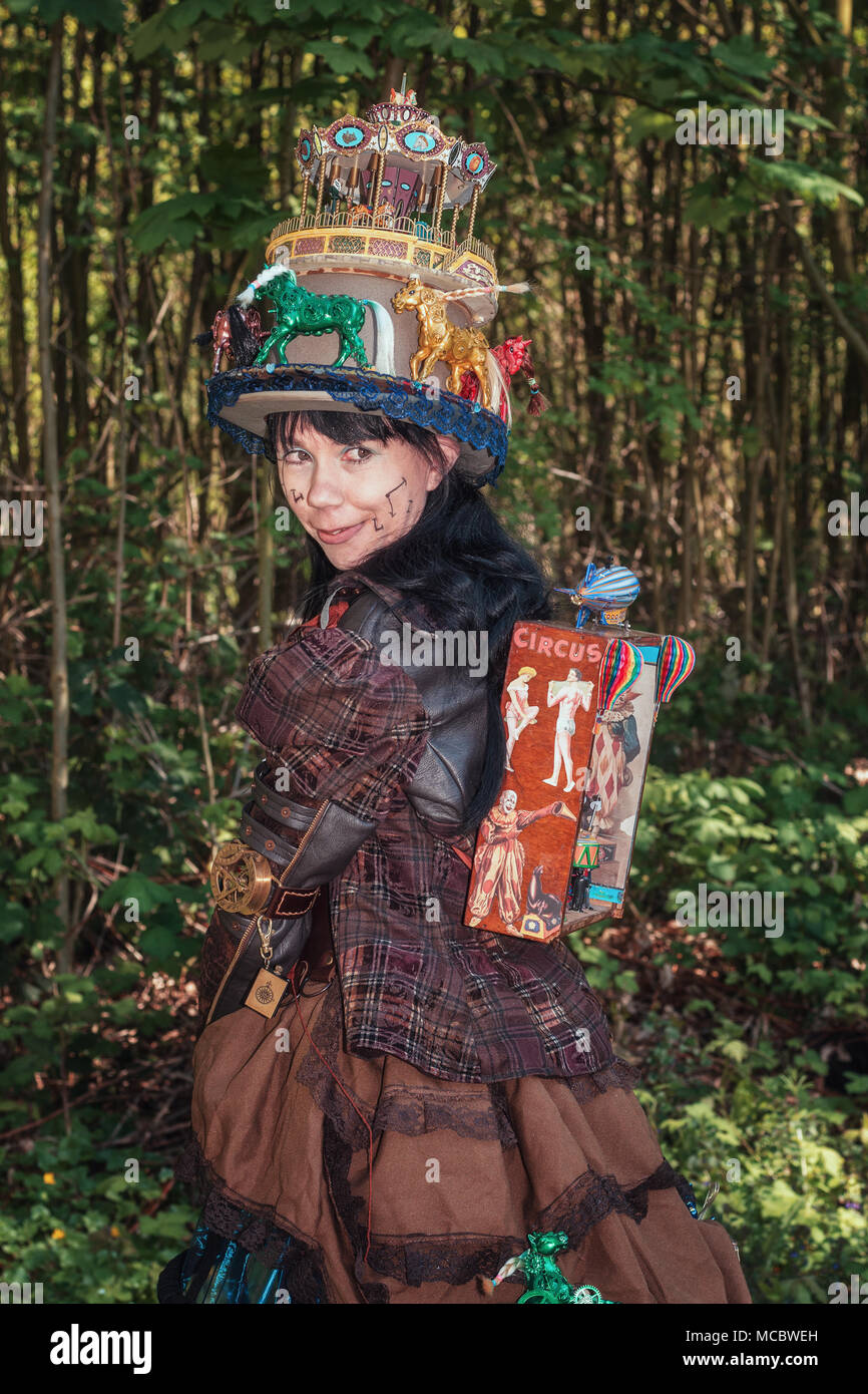 April  19, 2014, Haarzuilens, The Netherlands: Steampunk girl decorated with circus and fun fair attributes during the Elf Fantasy Fair (Elfia) is an  Stock Photo