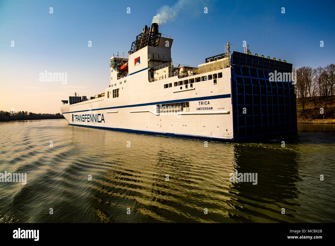 Various vessels on transit through the Kiel canal from the locks at Brunsbuttel through to Kiel Stock Photo