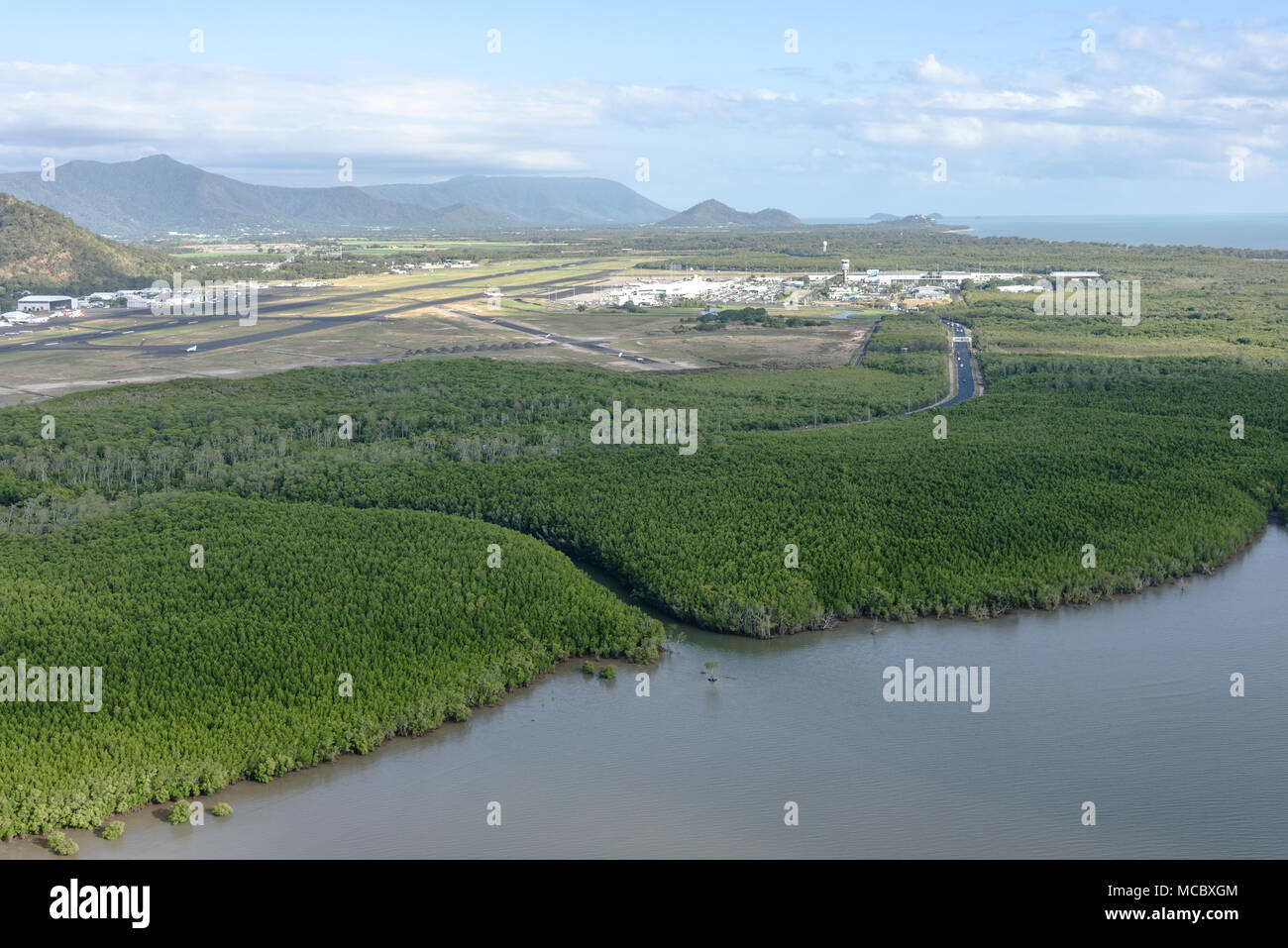 An aerial view of Cairns Airport after takeoff on a sunny day Stock Photo