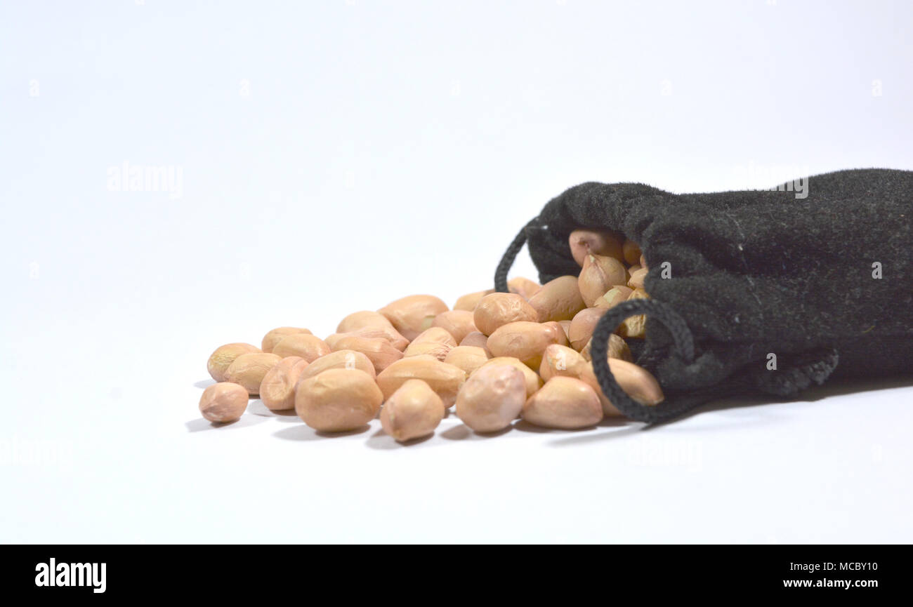 Peanuts in burlap bag isolated on white background Stock Photo