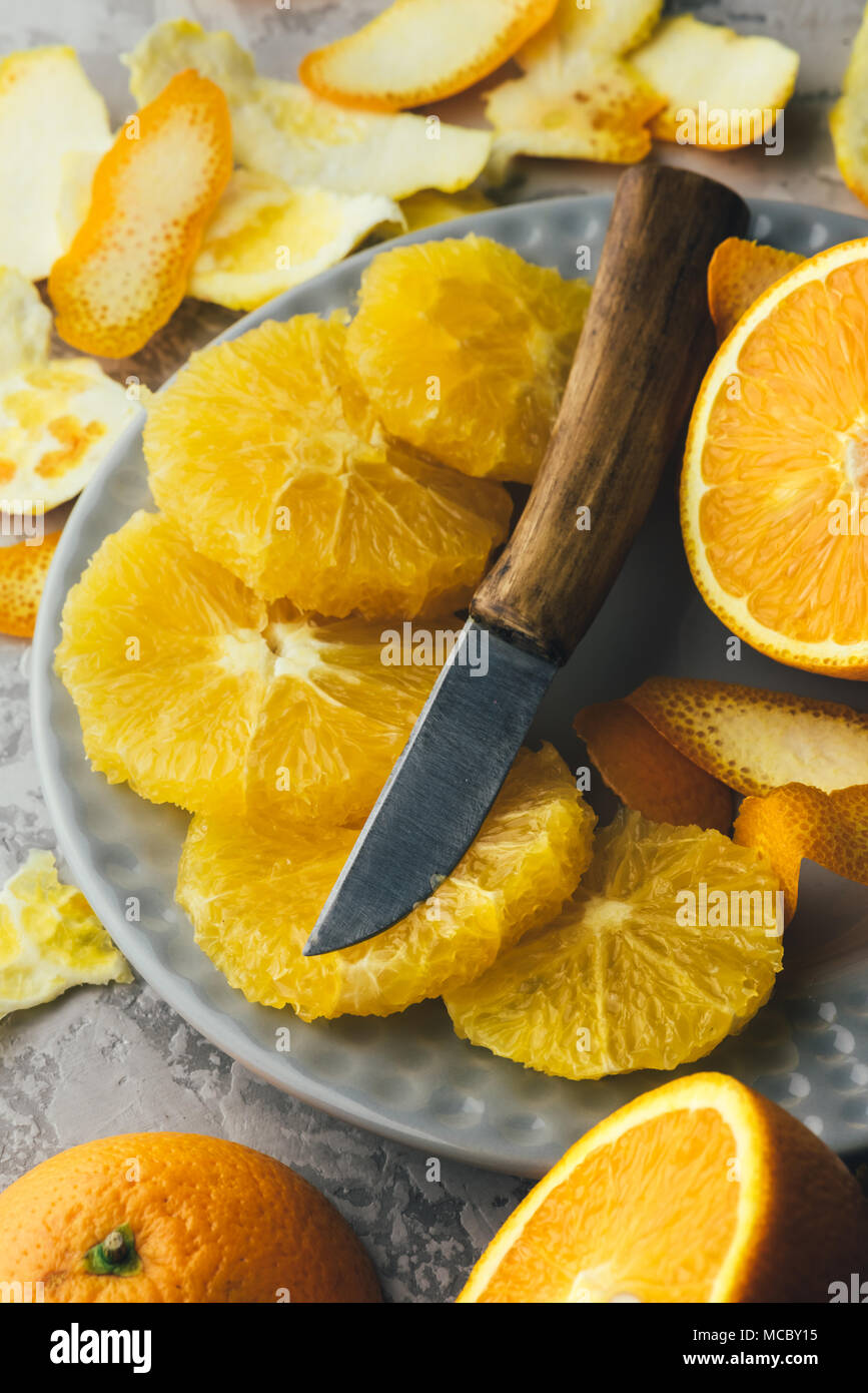 Orange pieces on grey plate closeup Stock Photo