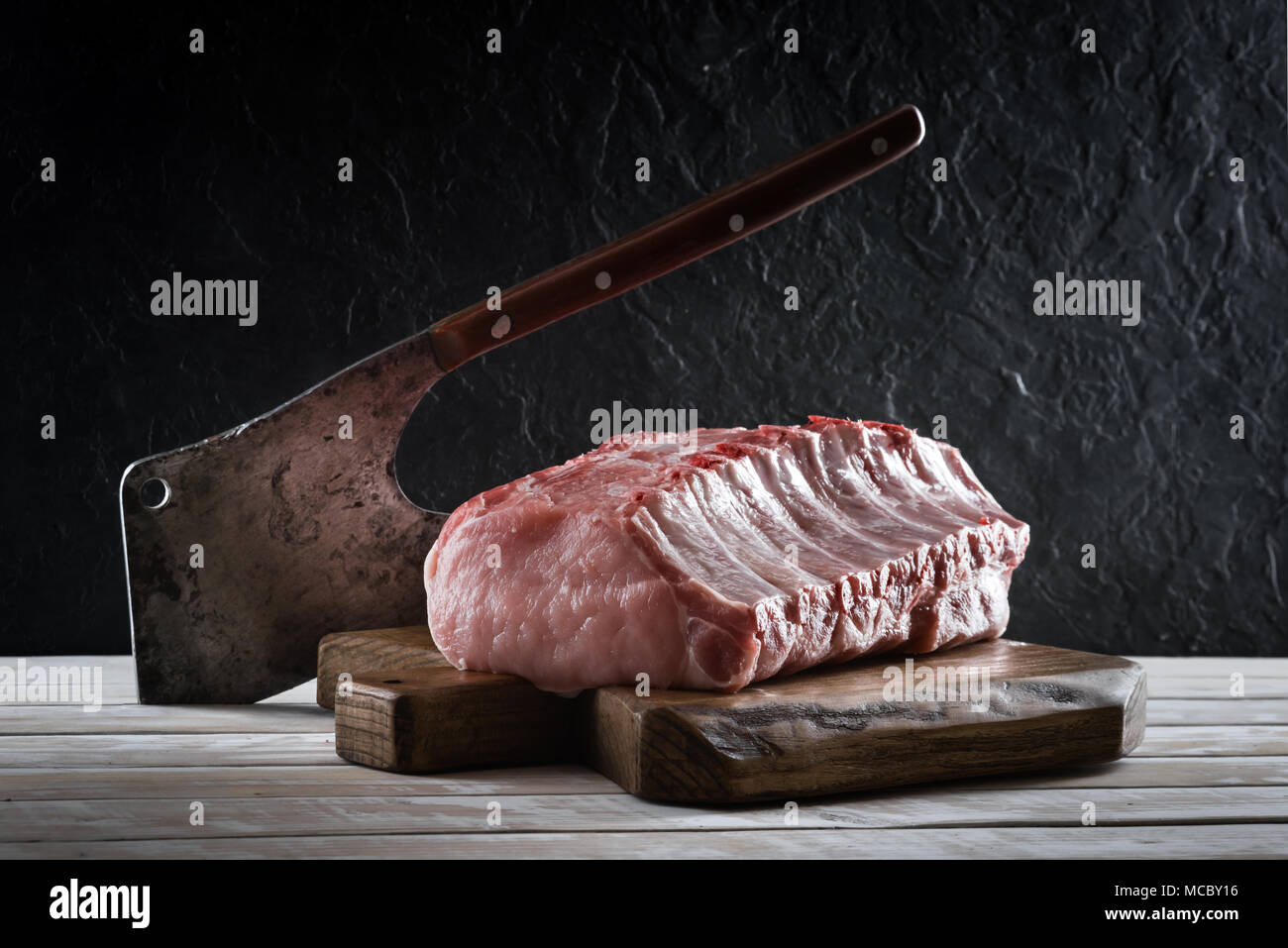Fresh raw pork piece on wooden board Stock Photo