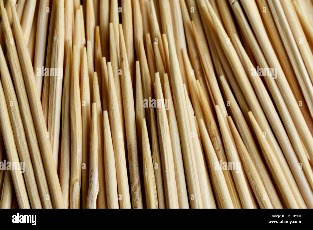 Closeup of stack of wooden toothpicks or cocktail sticks Stock Photo