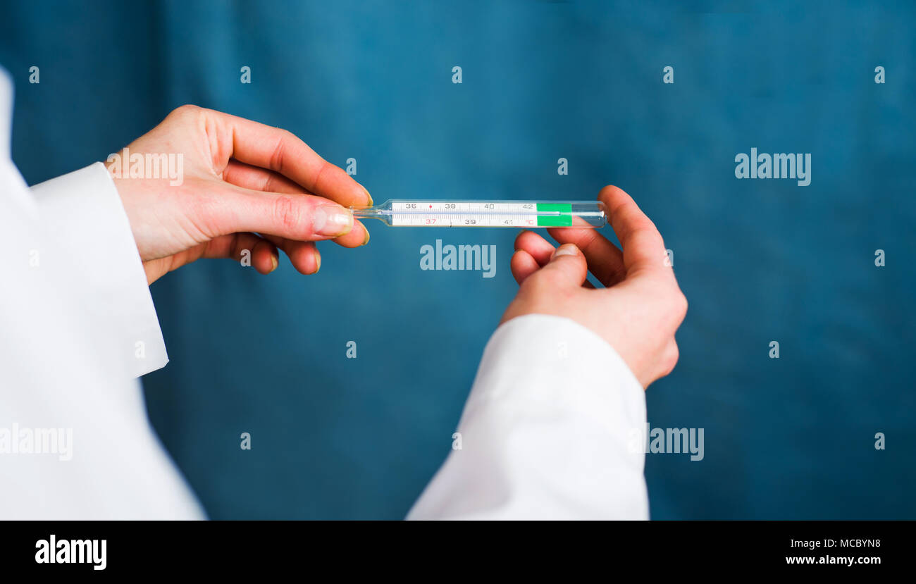 https://c8.alamy.com/comp/MCBYN8/doctor-holding-a-body-thermometer-close-up-MCBYN8.jpg
