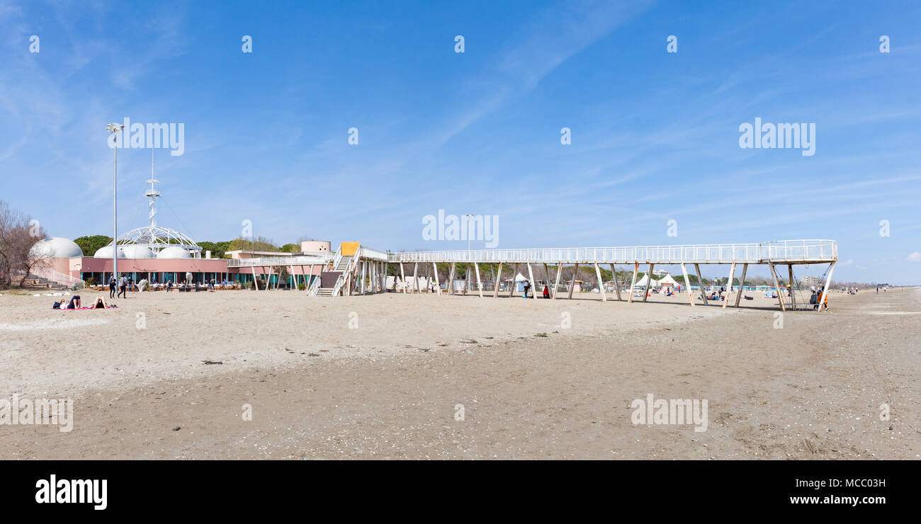 Stitched panorama of Blue Moon Beach, Lido di Venezia (Venice Lido), Venice, Veneto, Italy with the restaurants, pier and observation tower in early s Stock Photo