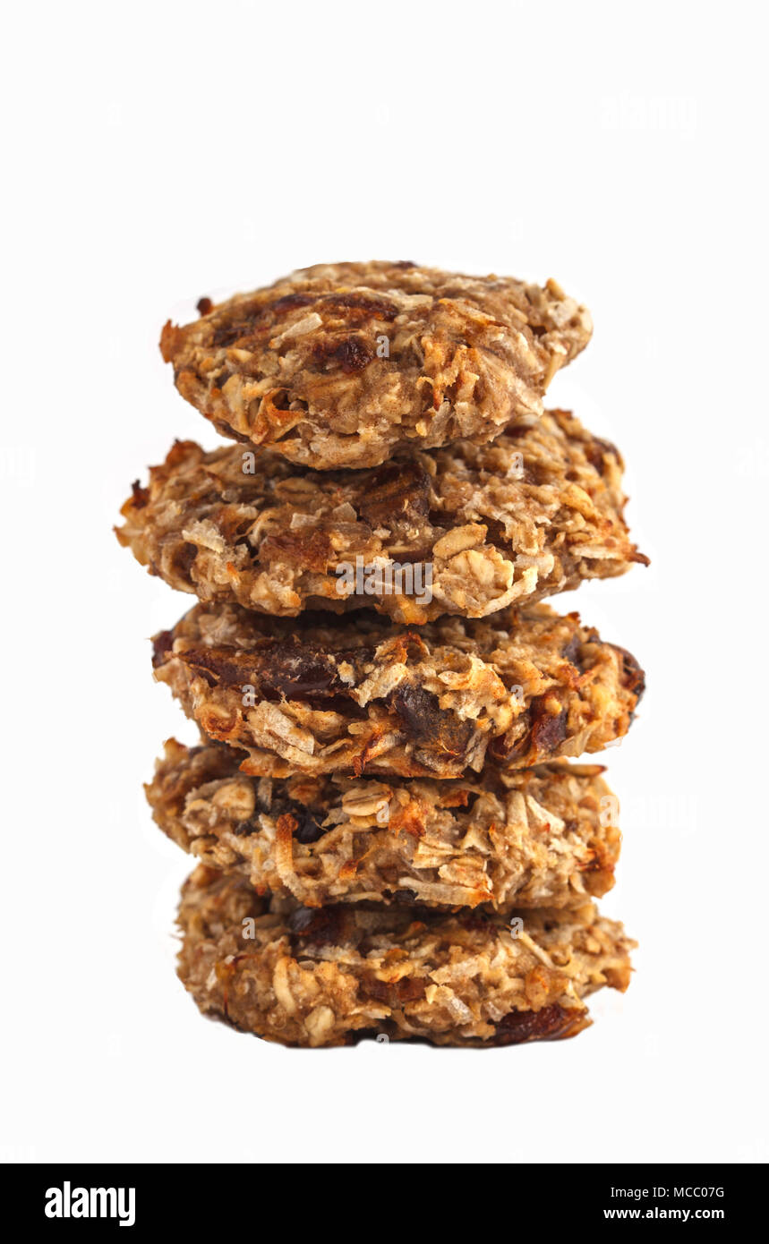 Vegan oatmeal cookies with dates and a banana. Healthy vegan detox dessert on a white background Stock Photo
