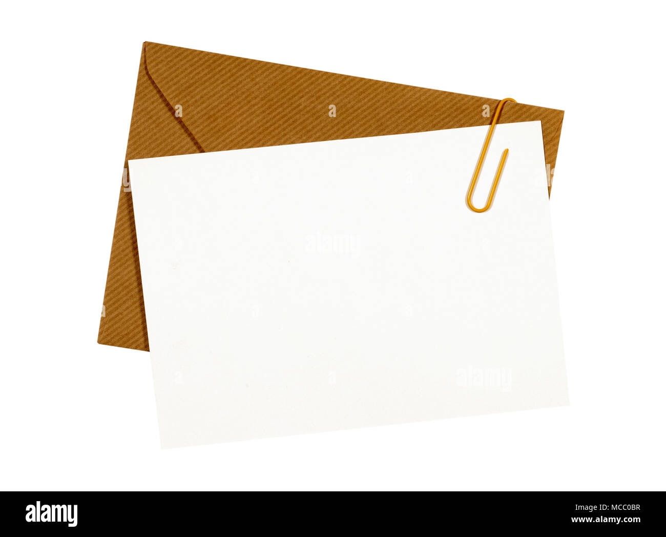 Brown manila envelope, blank letter or message card, paper clip, copy