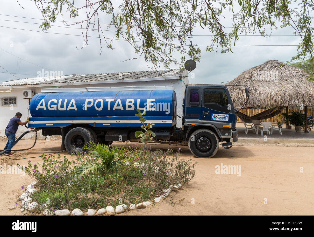 Truck delivers potable water to residents in rural area. Colombia, South America. Stock Photo