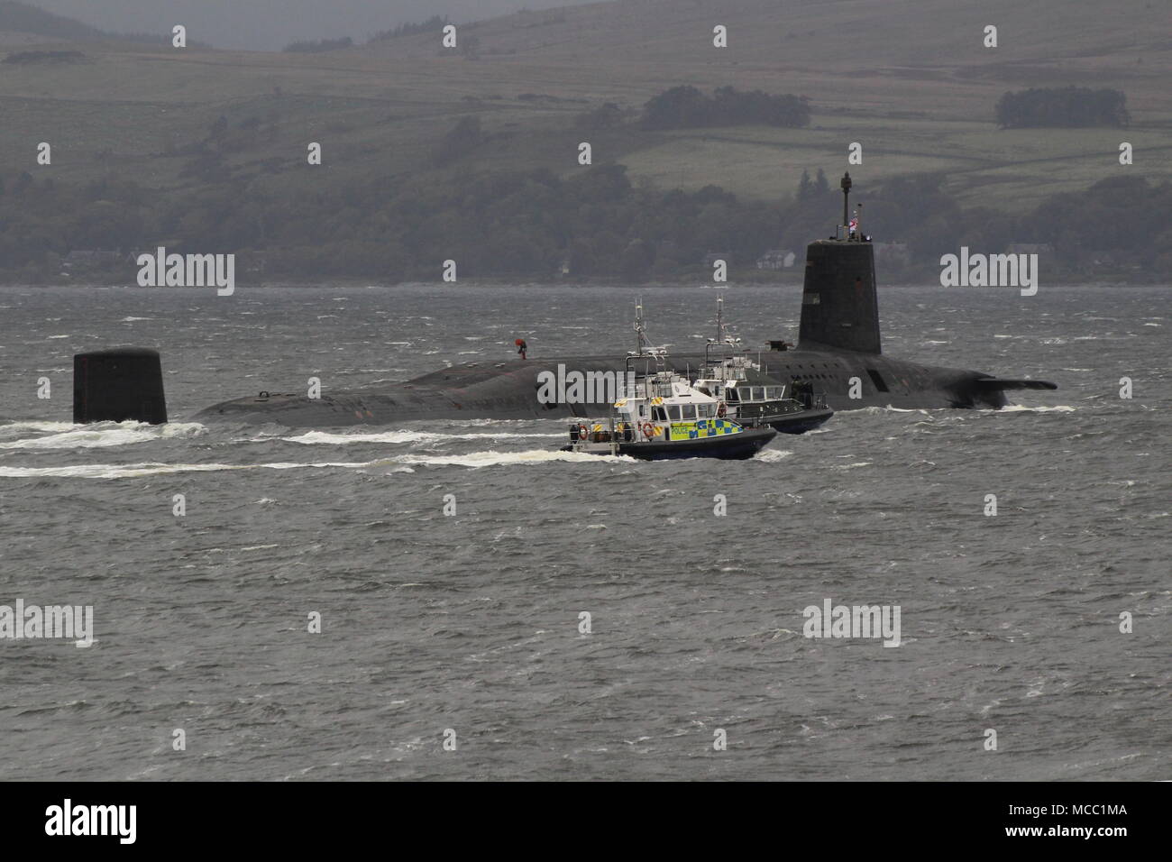HMS Victorious (S29), a Vanguard-class submarine operated by the Royal Navy, passing Gourock on an inbound journey to the Faslane naval base. Stock Photo