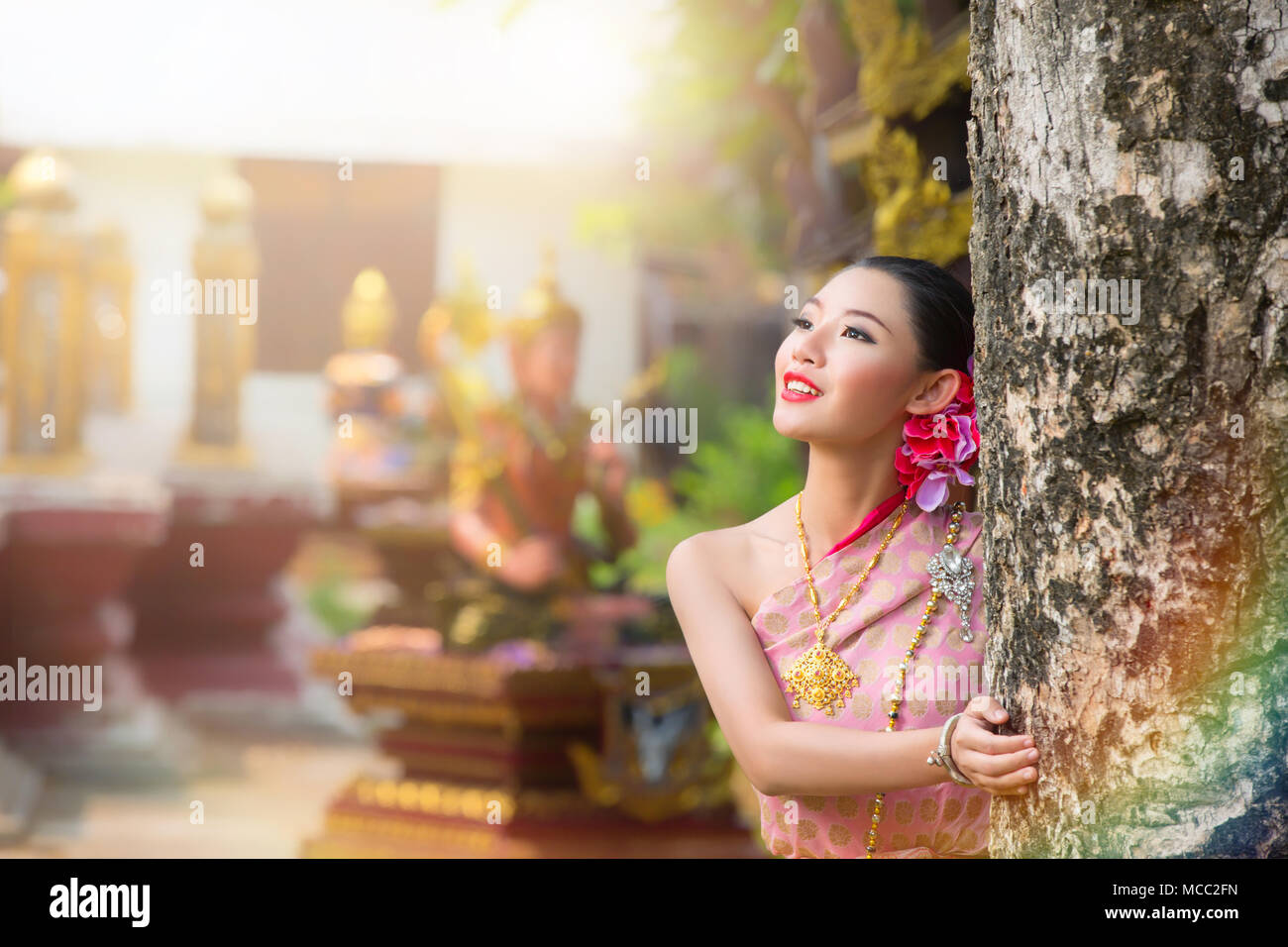 Thai girl with northern style dress in Waterfall,  identity culture of thailand. Stock Photo