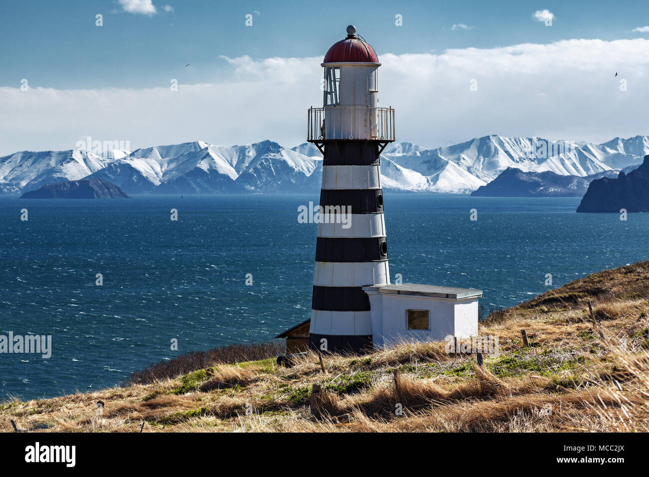 Petropavlovsky Lighthouse is located on Mayachny Cape on Kamchatka Peninsula on shore of picturesque Avacha Gulf in the Pacific Ocean Stock Photo
