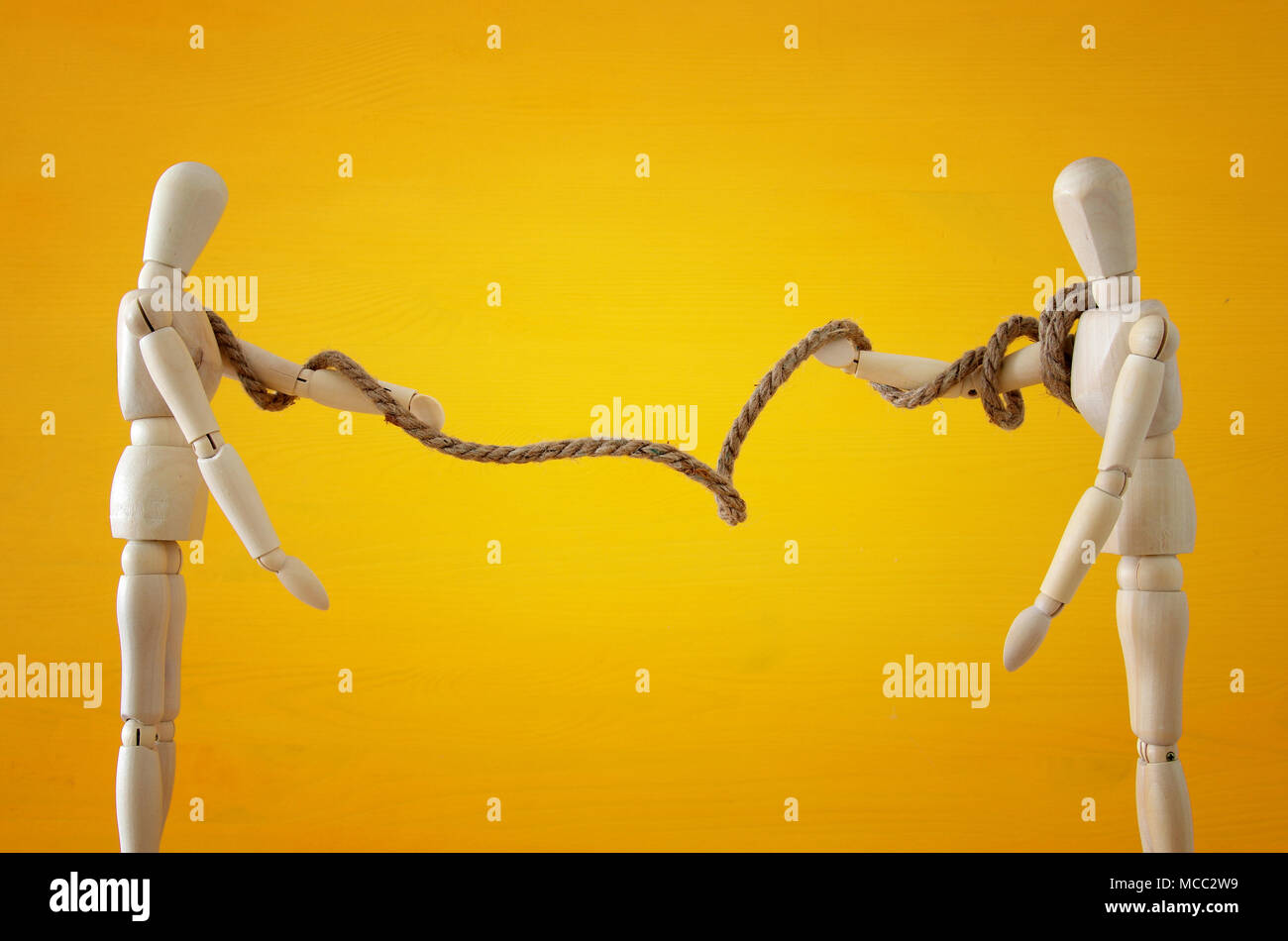 Competition concept. two wooden people pull rope symbol of rivalry ...