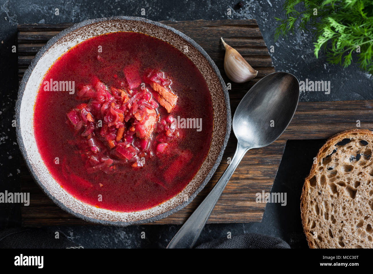 Beet soup Borscht in rustic bowl, table top view Stock Photo