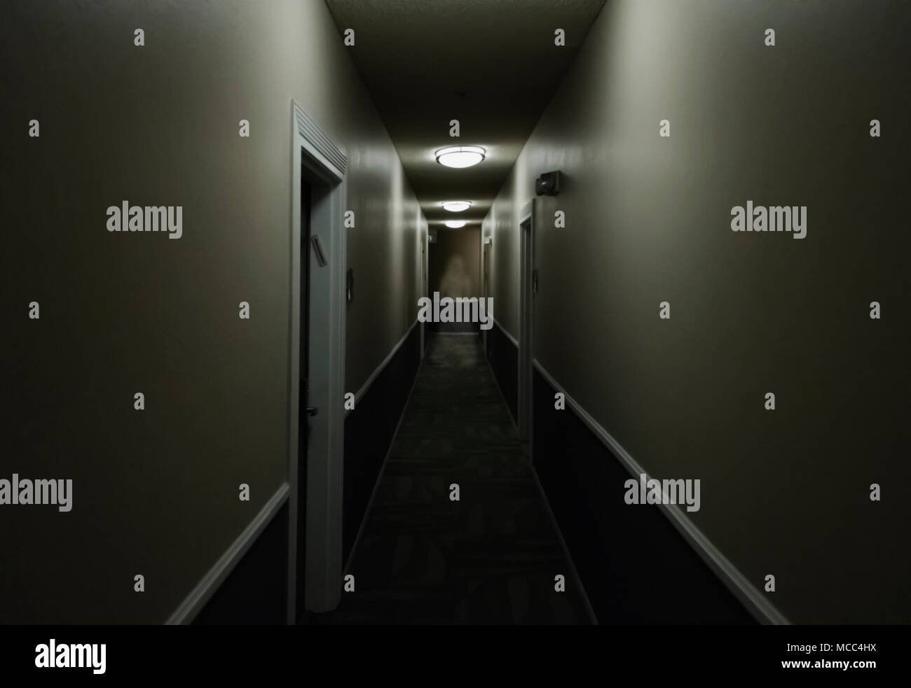 Artistic vision of a ghost of a woman standing in a hallway. Stock Photo